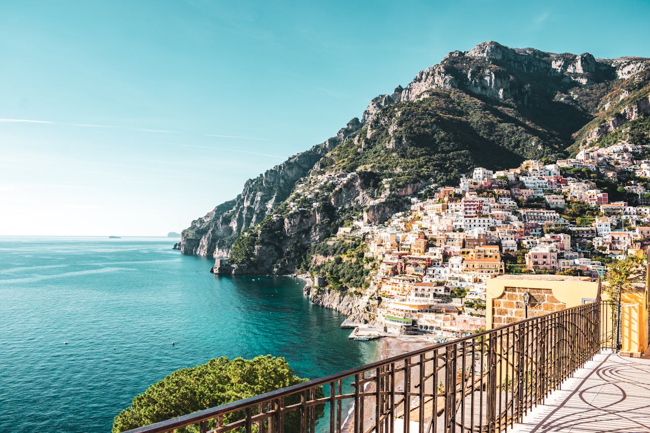 Stunning view of Positano's colorful buildings on the cliffs overlooking the Mediterranean Sea.