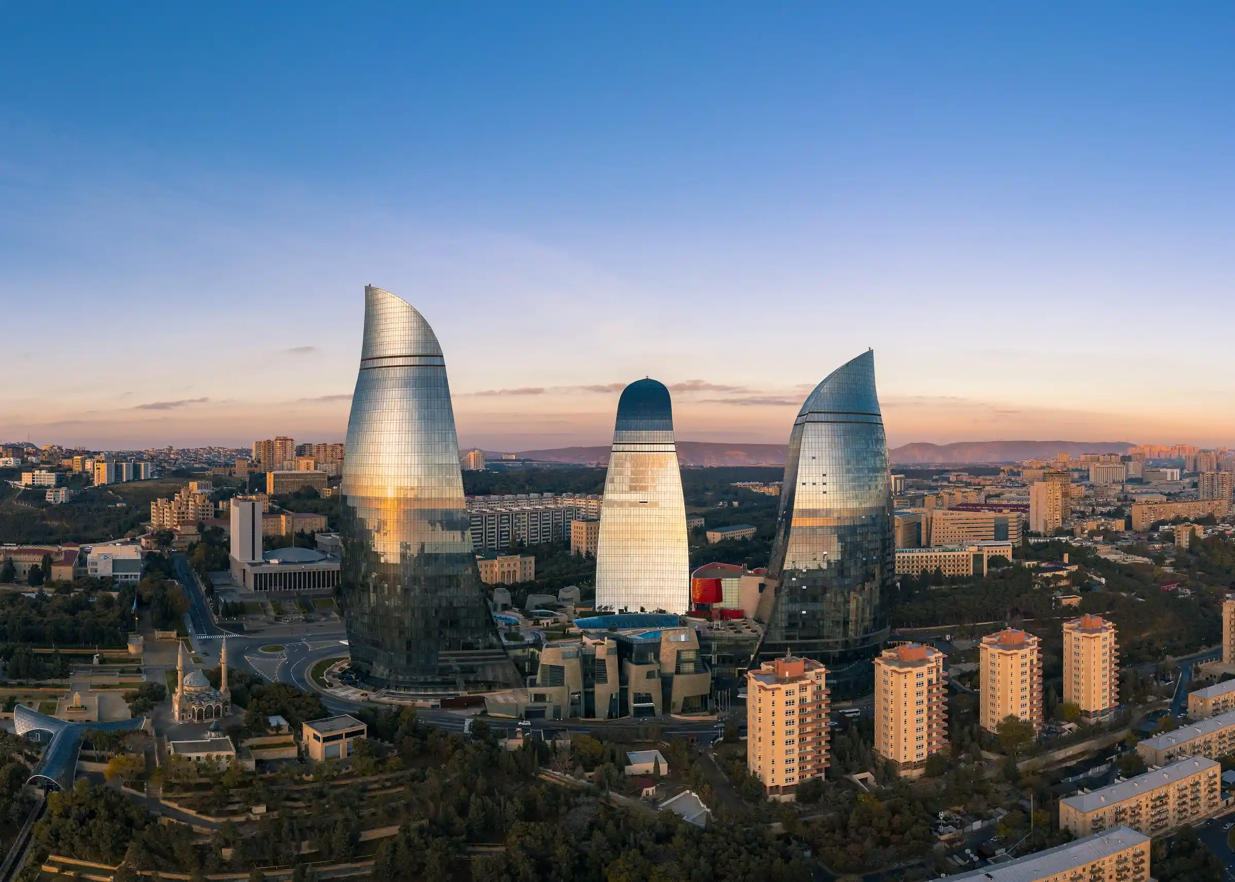 The Flame Towers rising above the Baku skyline at sunset, Azerbaijan