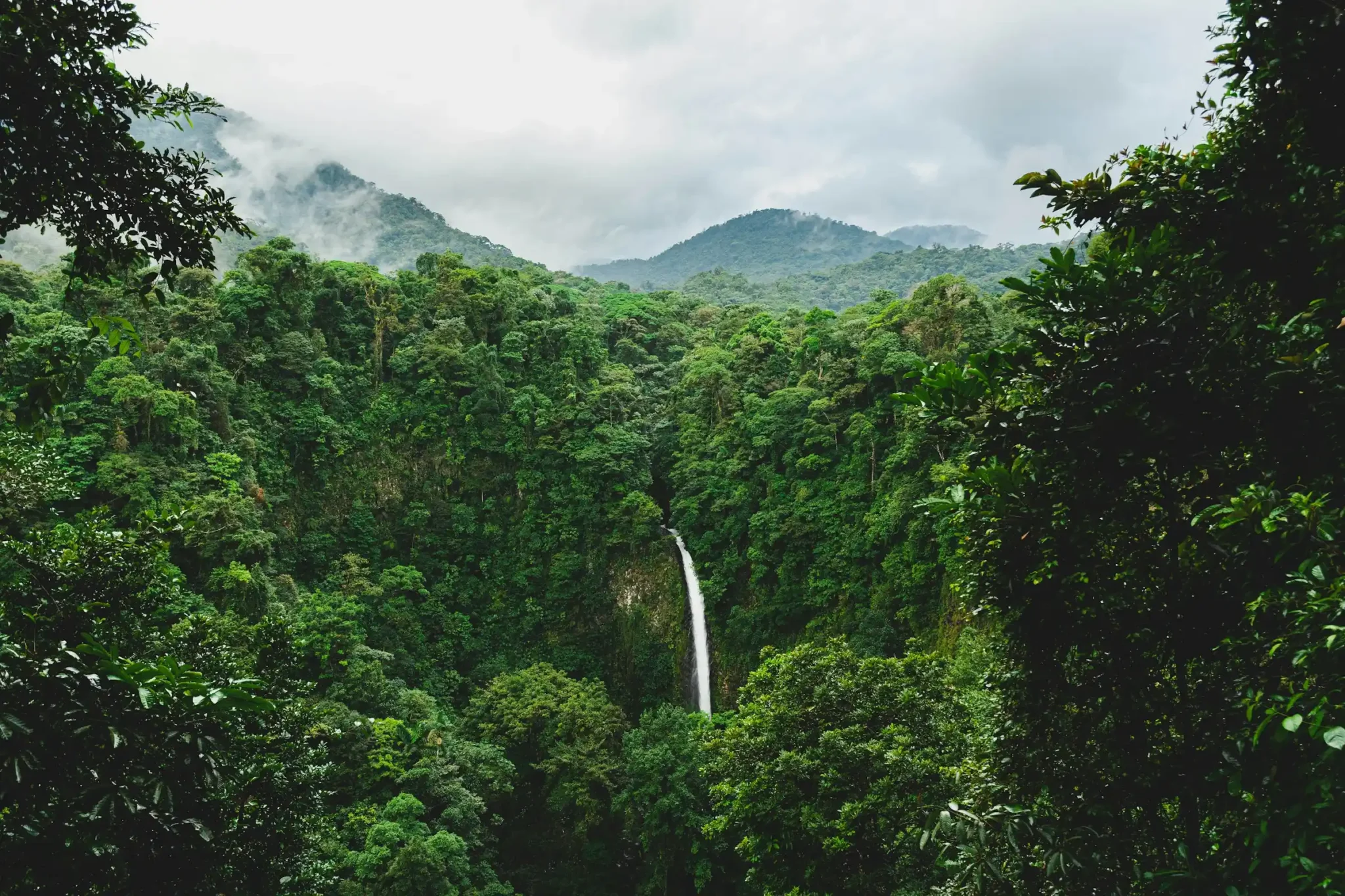 La Fortuna Waterfall cascading through the rainforest near Arenal Volcano, Costa Rica