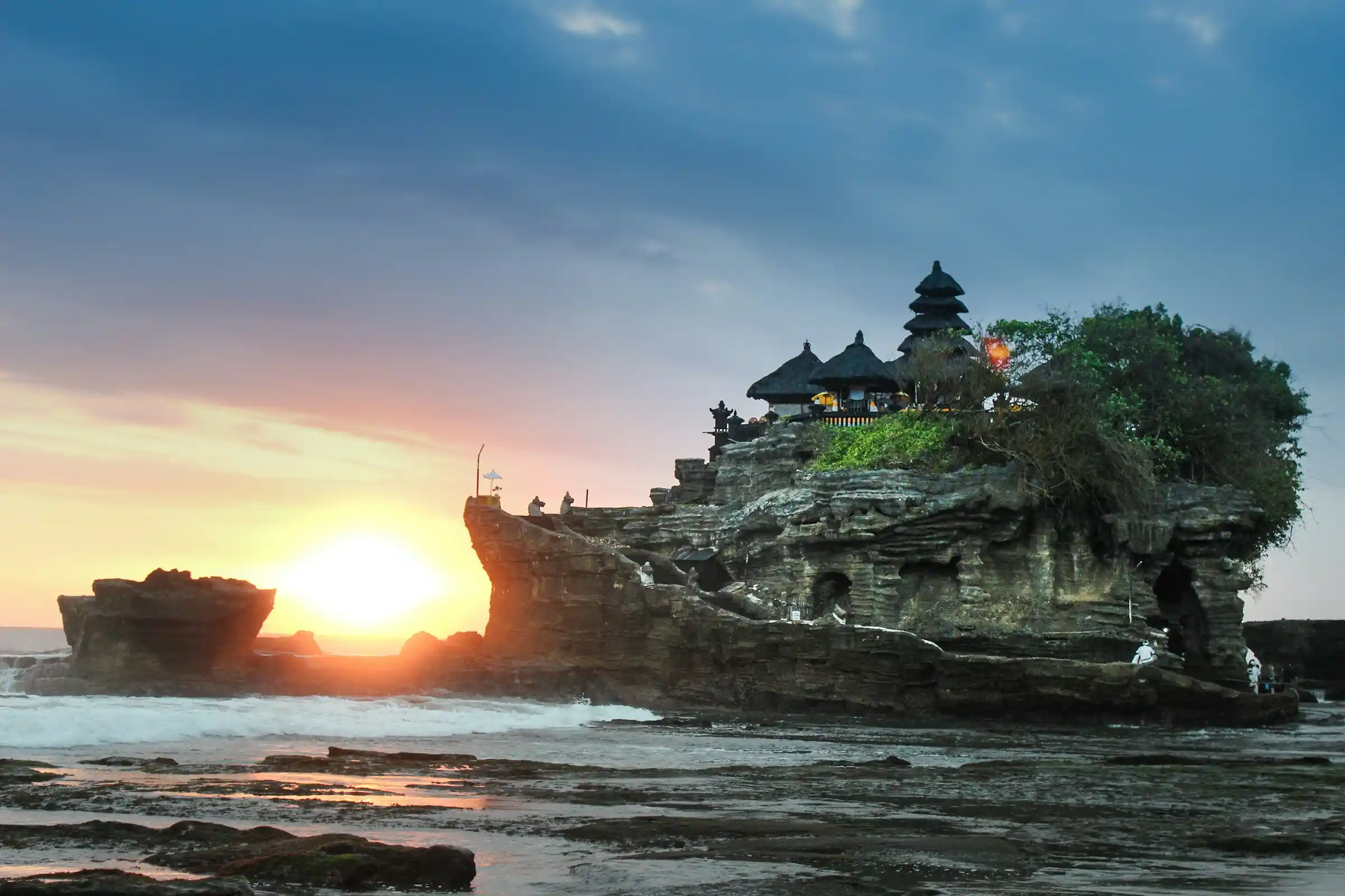 The sea temple of Tanah Lot on its rocky outcrop at sunset, Bali, Indonesia