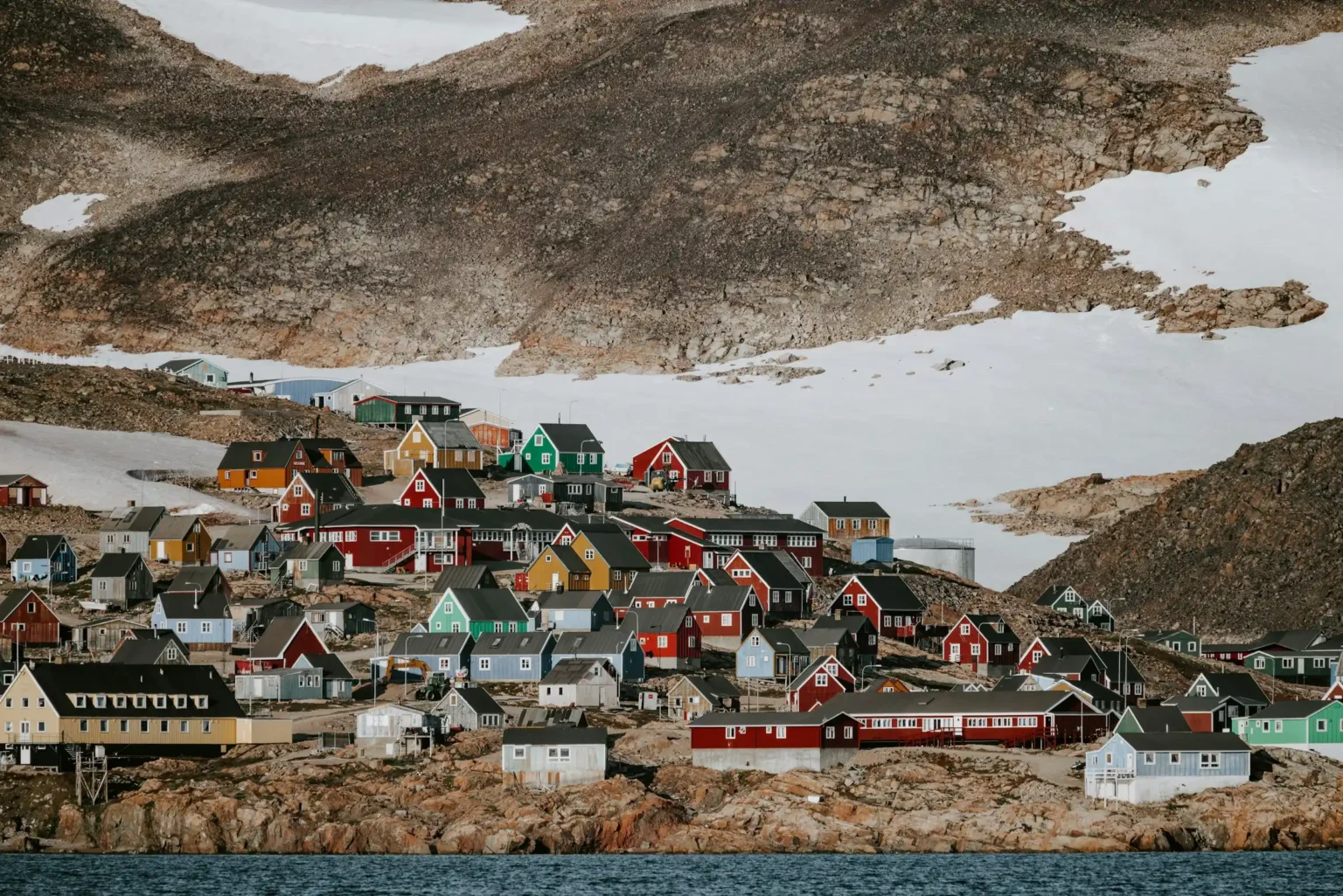 Colourful houses of Ittoqqortoormiit above the ice of Scoresby Sund, Greenland