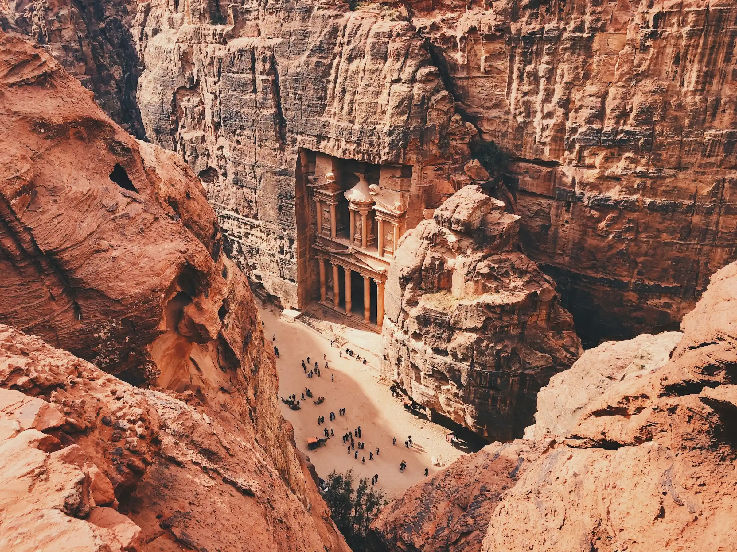 The Treasury (Al-Khazneh) carved into red rock at Petra, Jordan