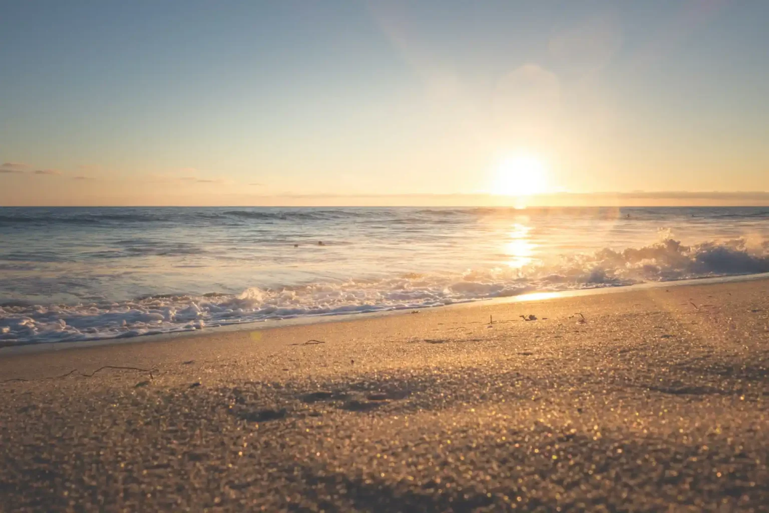 Traveller on a budget watching a warm-weather sunset in December