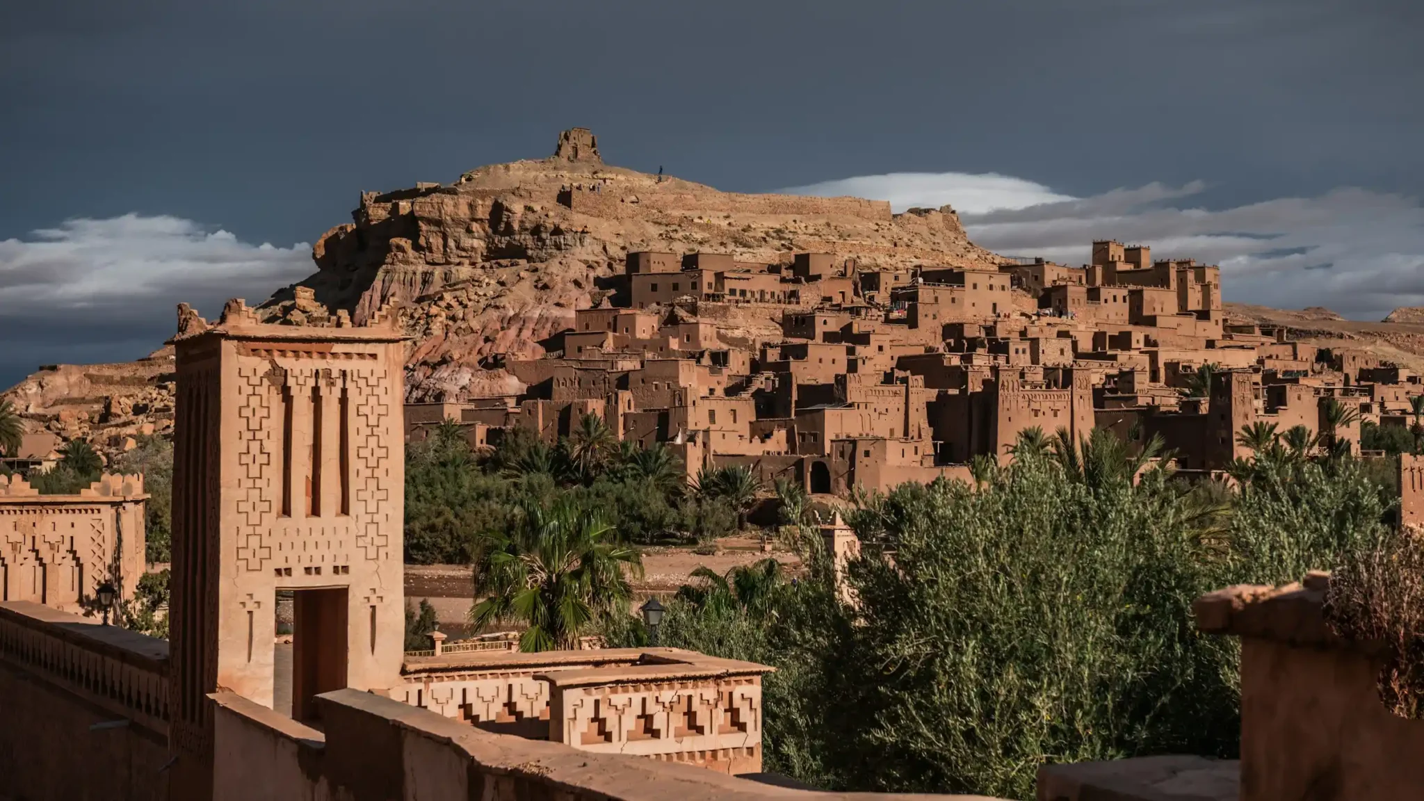 Ait Benhaddou fortified village (ksar) with its red earth buildings and the river in the foreground