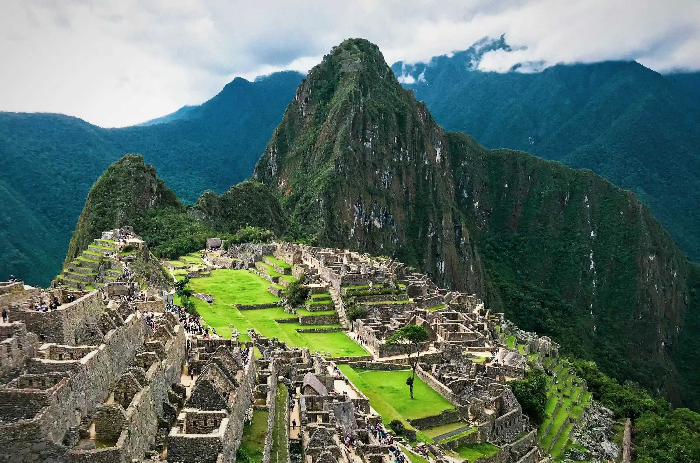 Machu Picchu ruins surrounded by misty mountain peaks in Peru