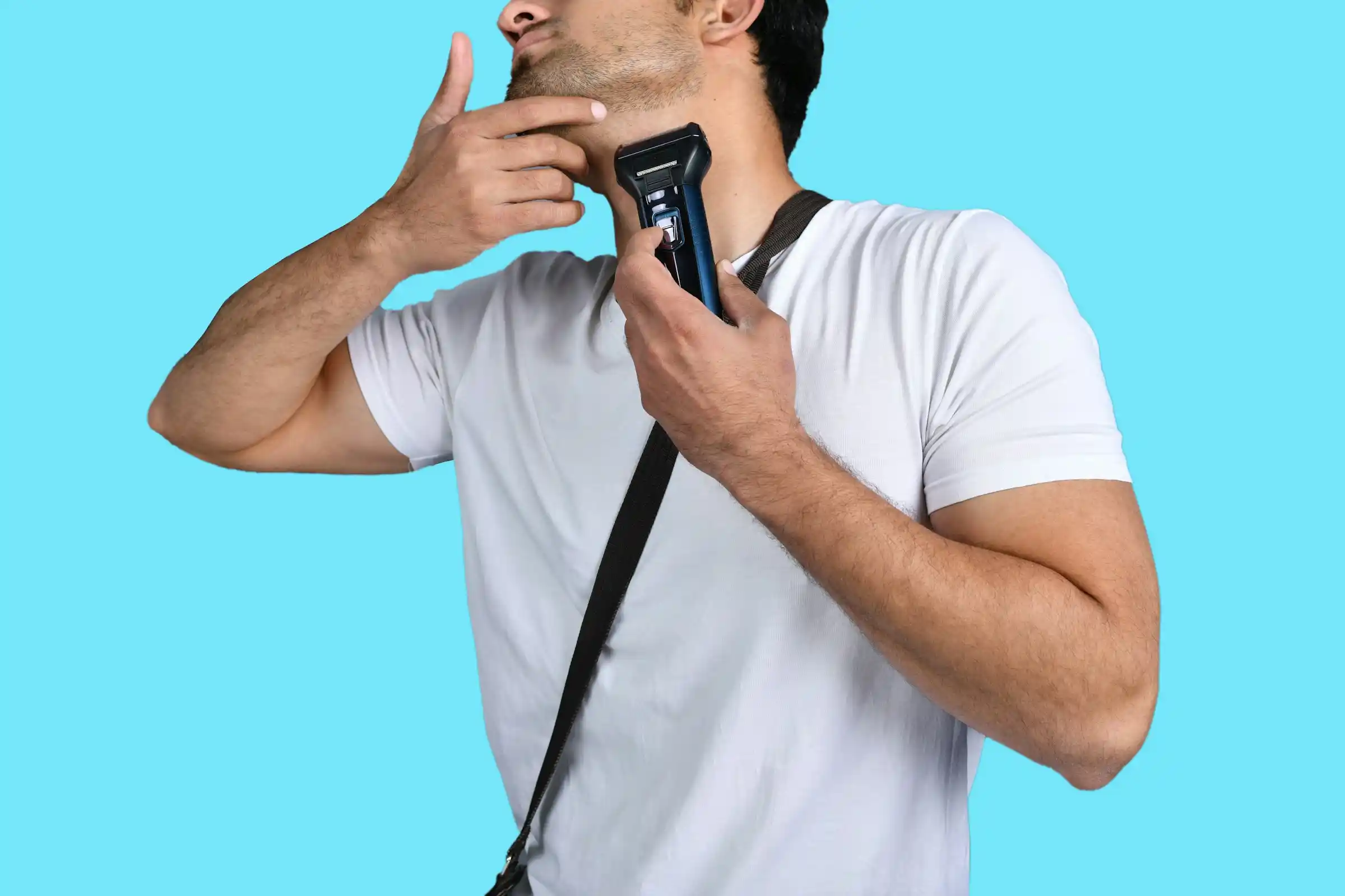 Man shaving his neck with an electric shaver