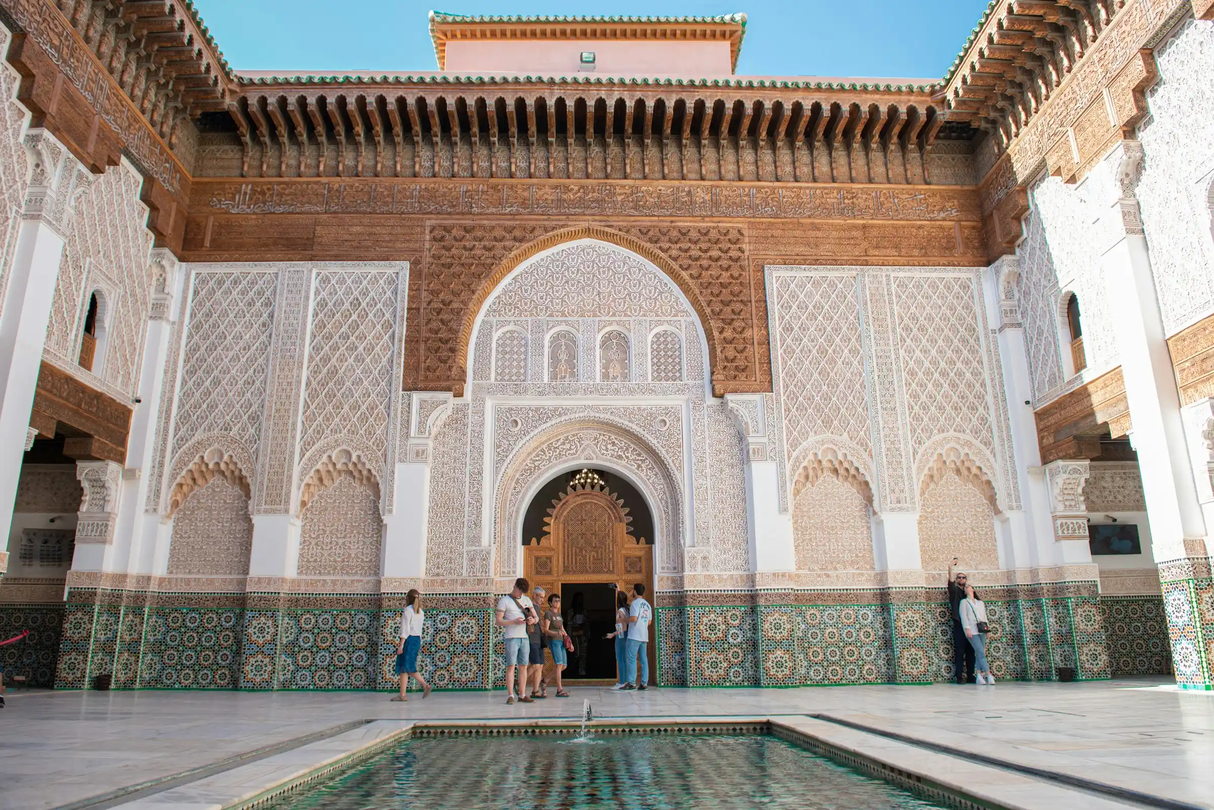 Panoramic view of a Moroccan city with traditional architecture and mountains in the background