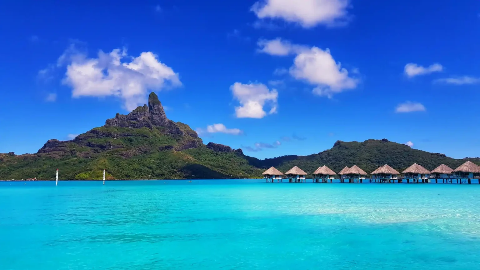 Mount Otemanu rising above the turquoise Bora Bora lagoon at dusk