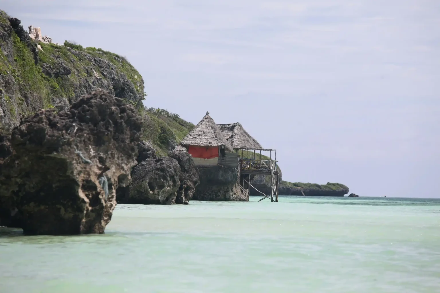 Mtende Beach on the southeast coast of Zanzibar with empty white sand and tropical vegetation