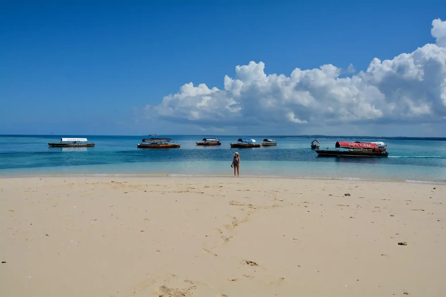Nakupenda sandbank near Stone Town with white sand surrounded by turquoise water