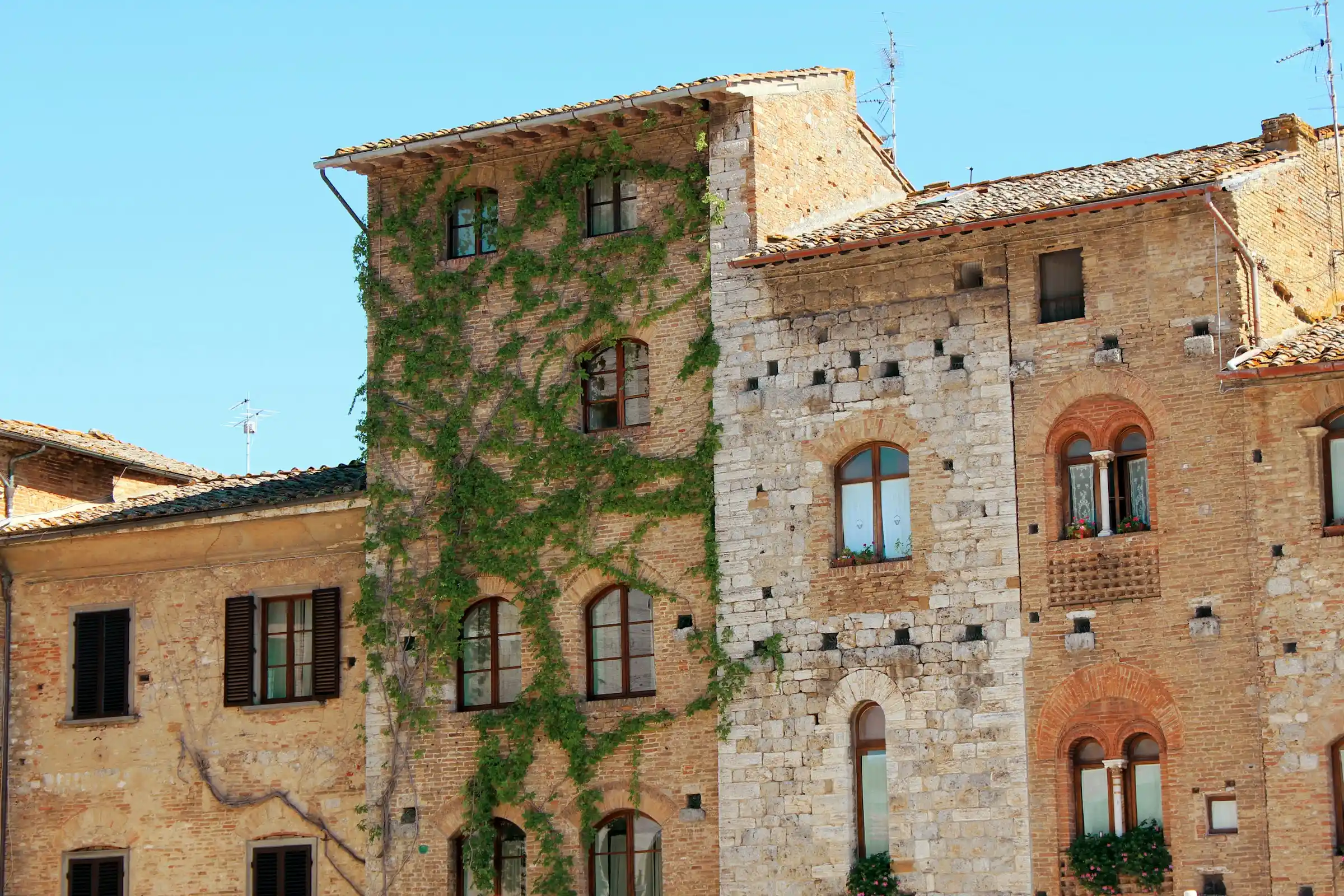 San Gimignano town with its medieval towers against a cloudy sky