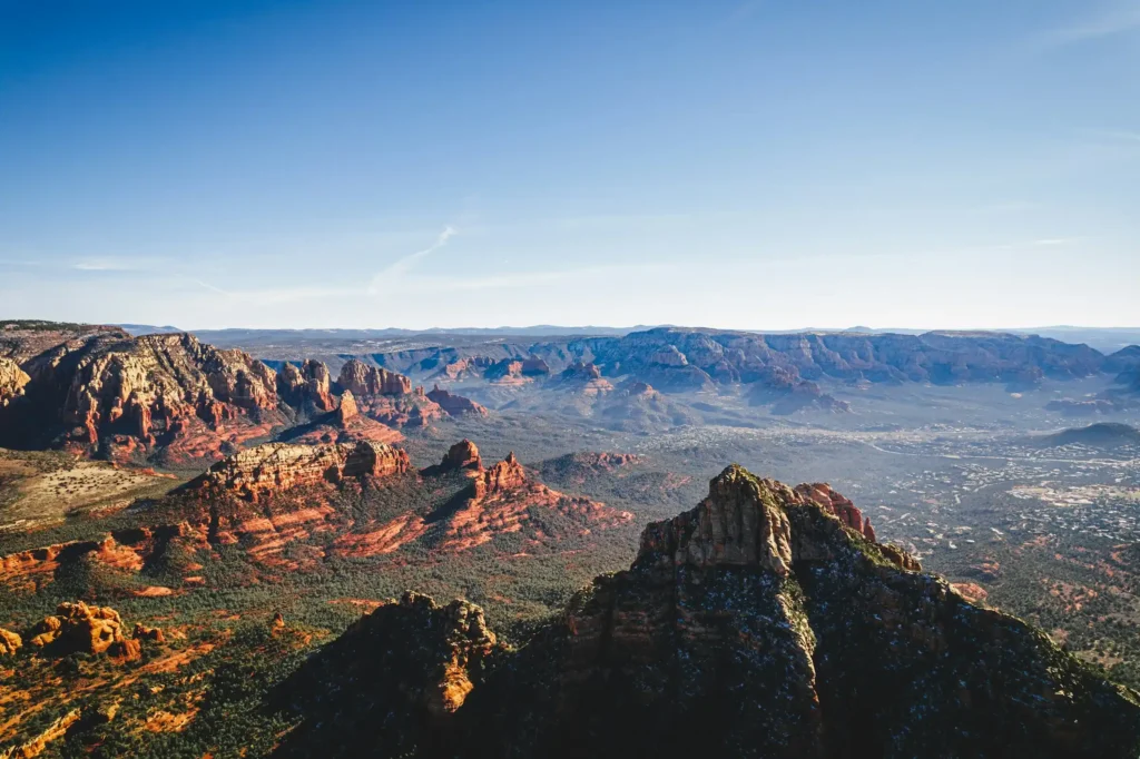 Sweeping view over Sedona's red rock canyons and buttes under a clear blue sky