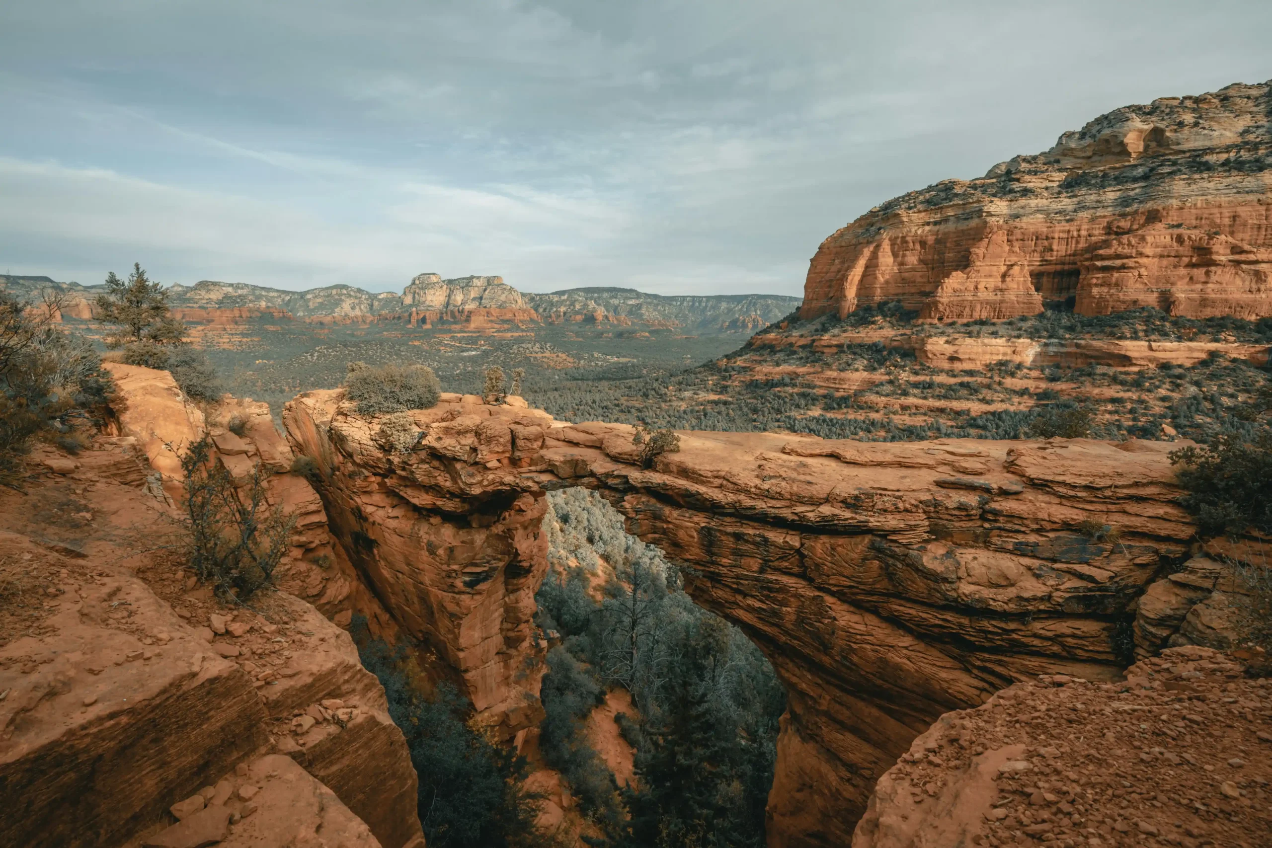 Devil's Bridge natural sandstone arch against Sedona's red rock landscape