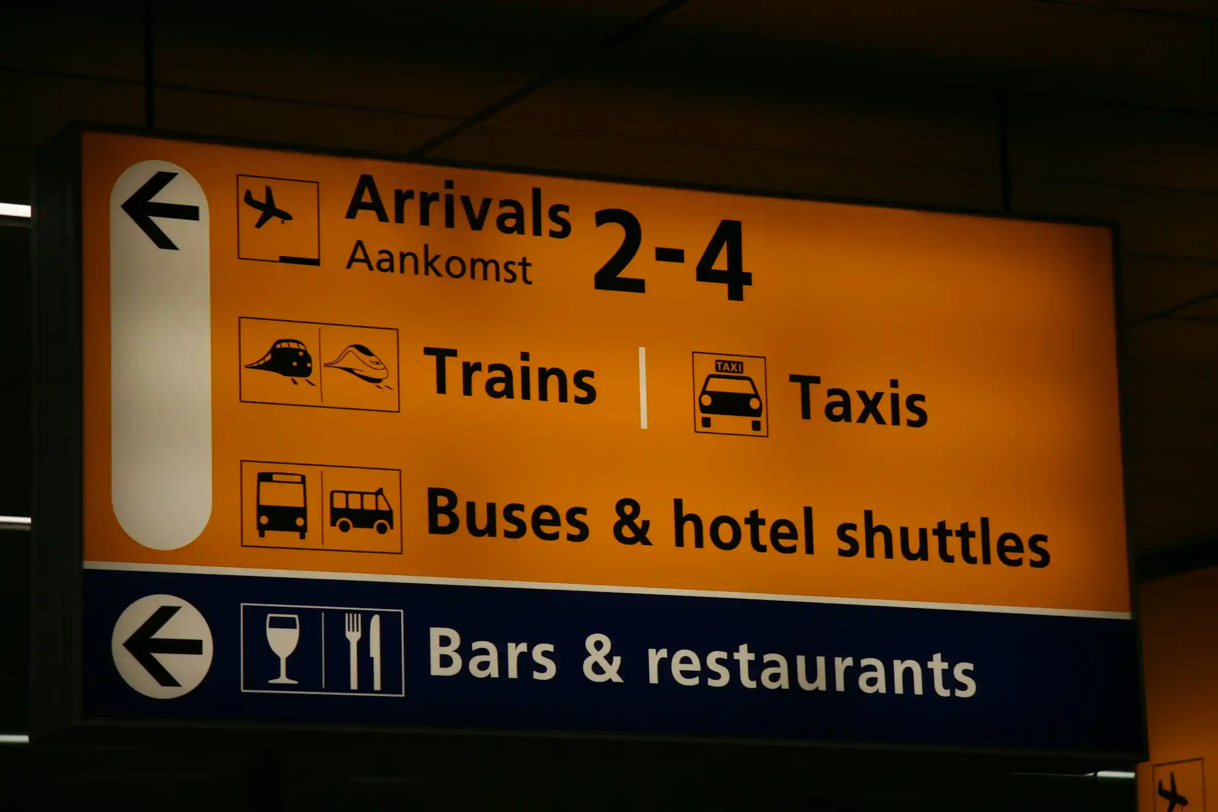 A train platform at Schiphol Airport with a train to Amsterdam Central