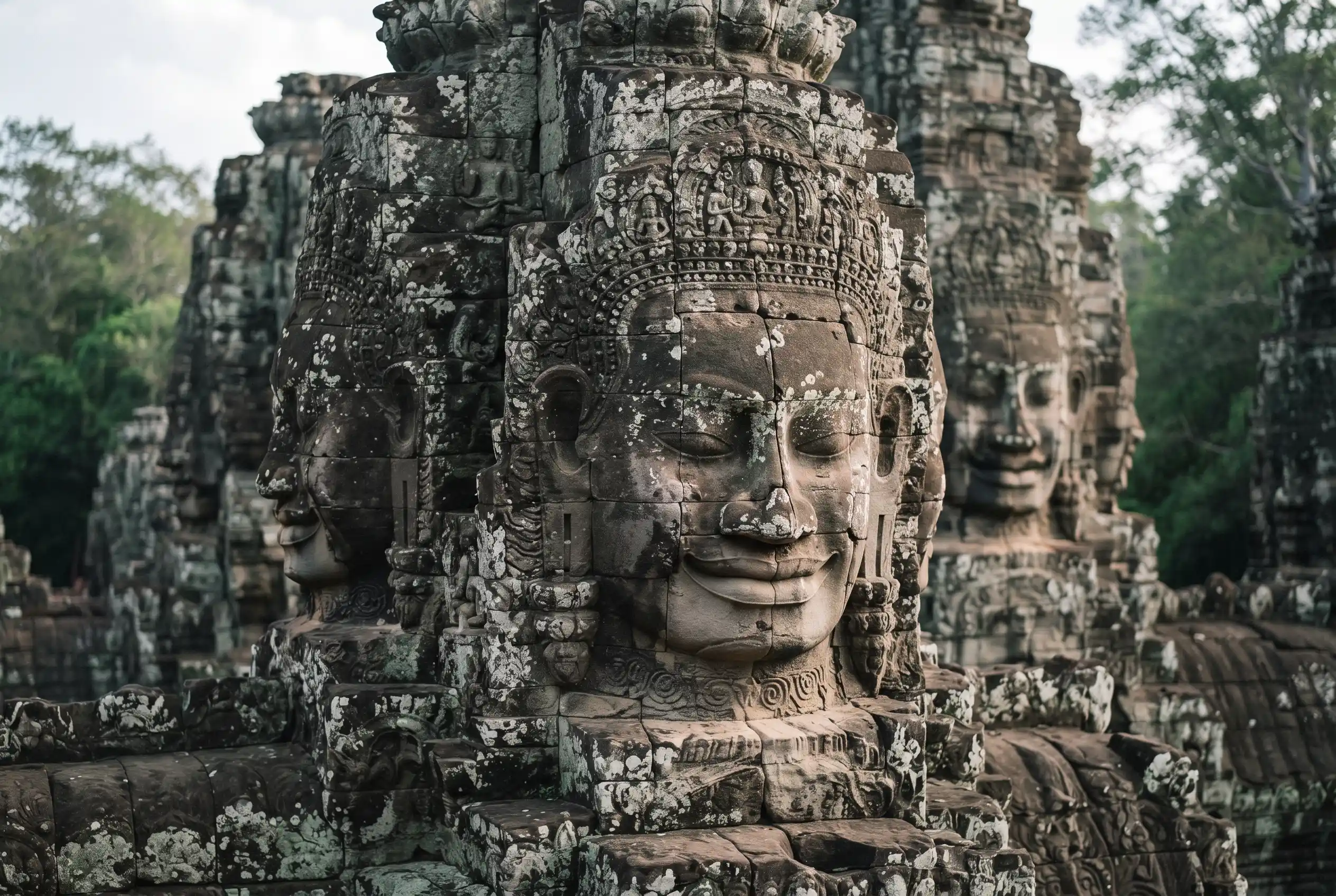 The giant stone faces of the Bayon temple at Angkor Thom