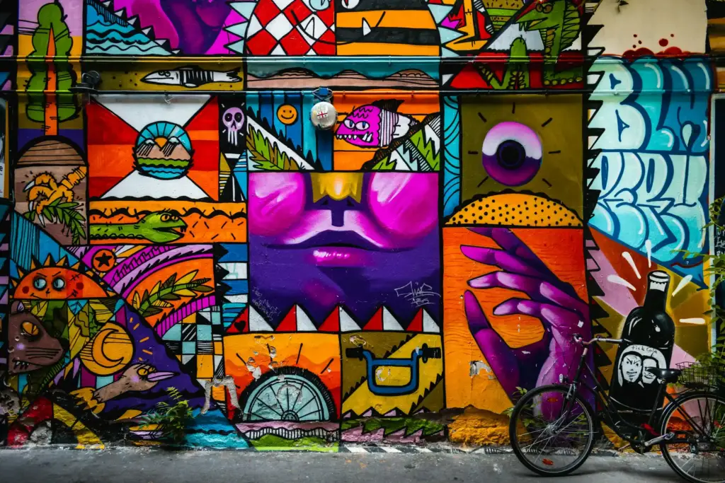 A large colourful mural on a building wall in Berlin