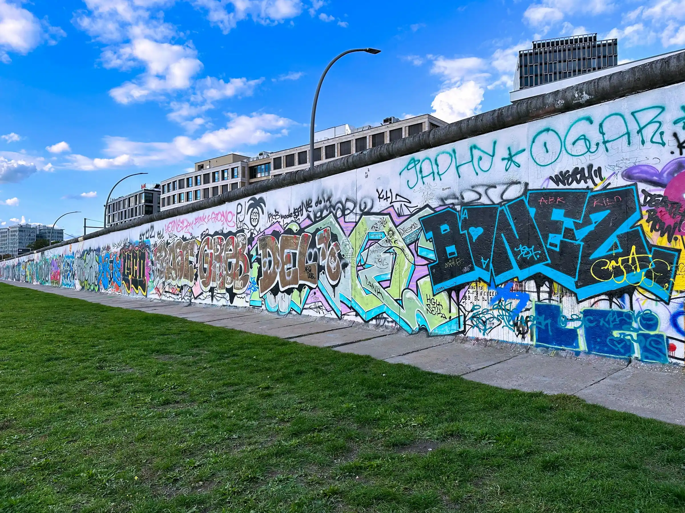A towering colourful mural covering the side of a building in Kreuzberg, Berlin