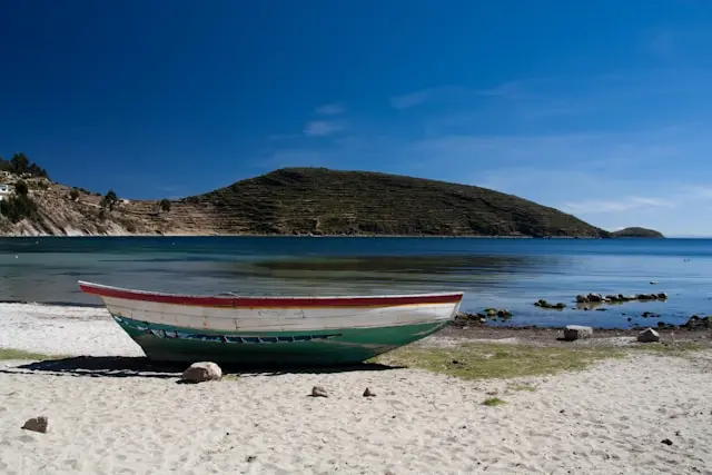 Isla del Sol showing terraced green hillsides rising from Lake Titicaca