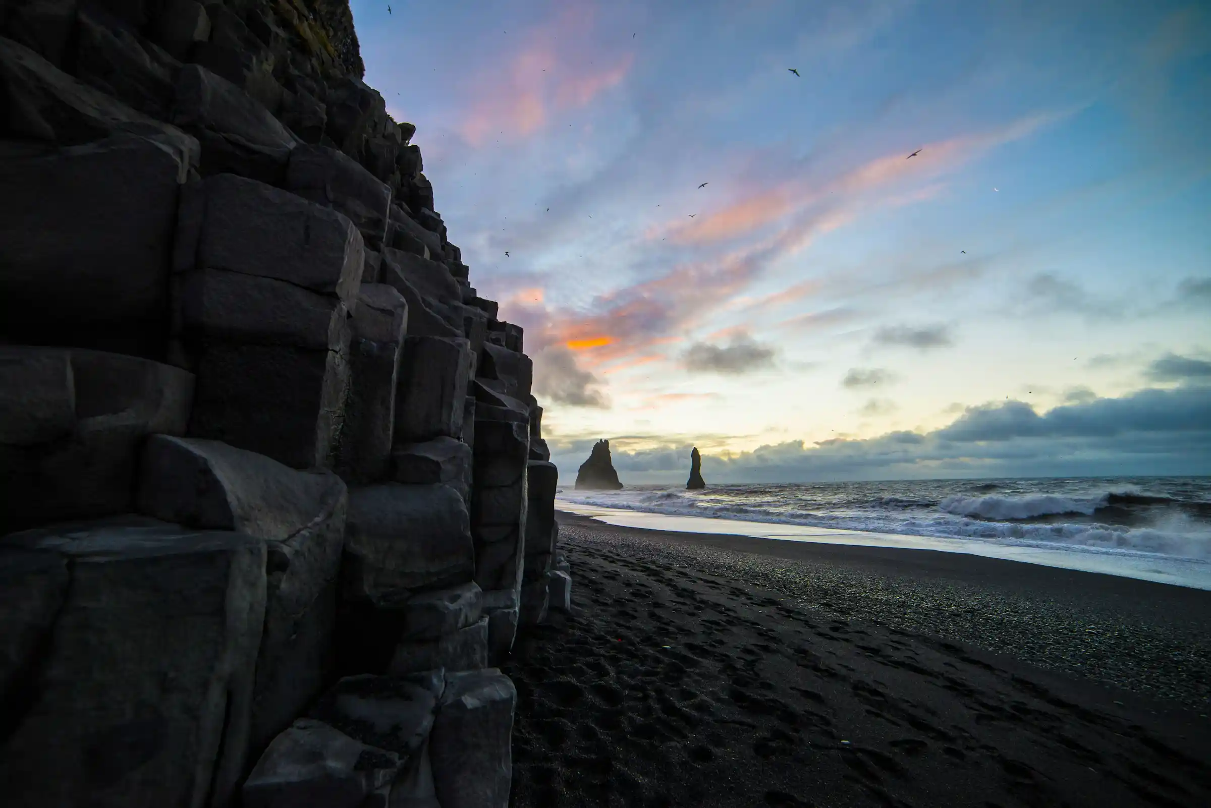 Basalt columns and black sand at Reynisfjara beach near Vik in Iceland