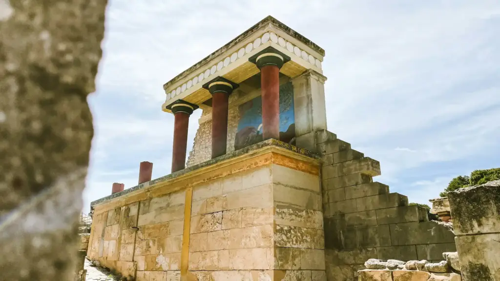 The ruins of the Palace of Knossos with reconstructed red columns in Crete