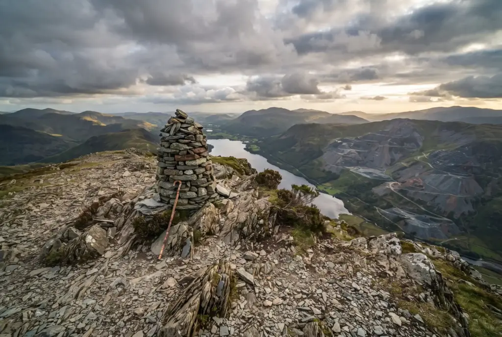 Summit cairn on the Old Man of Coniston with views over the fells