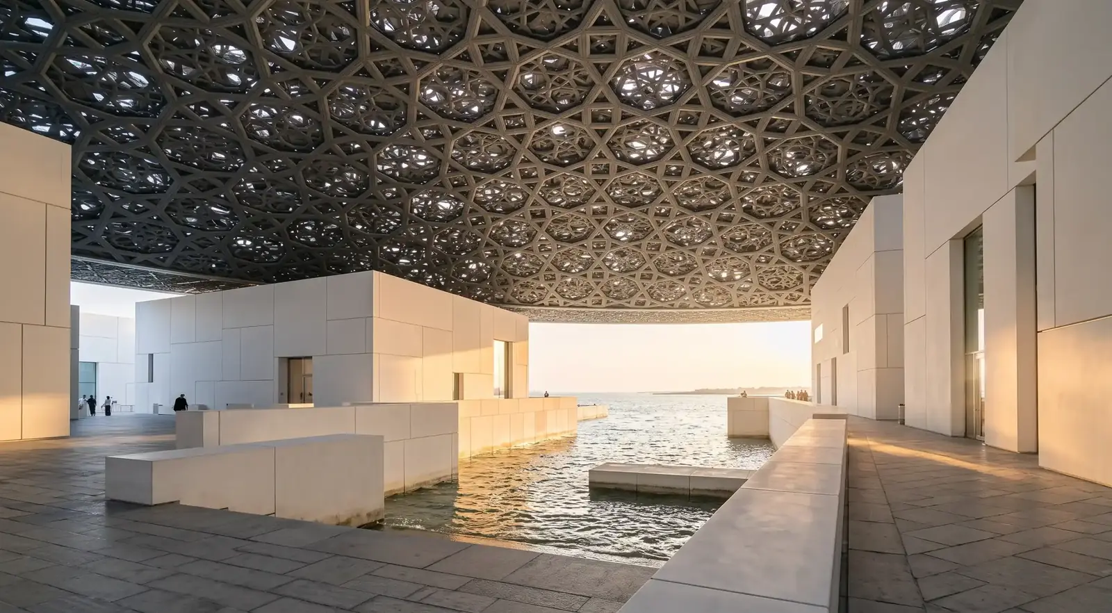 Geometric dome of Louvre Abu Dhabi representing places to visit in Abu Dhabi