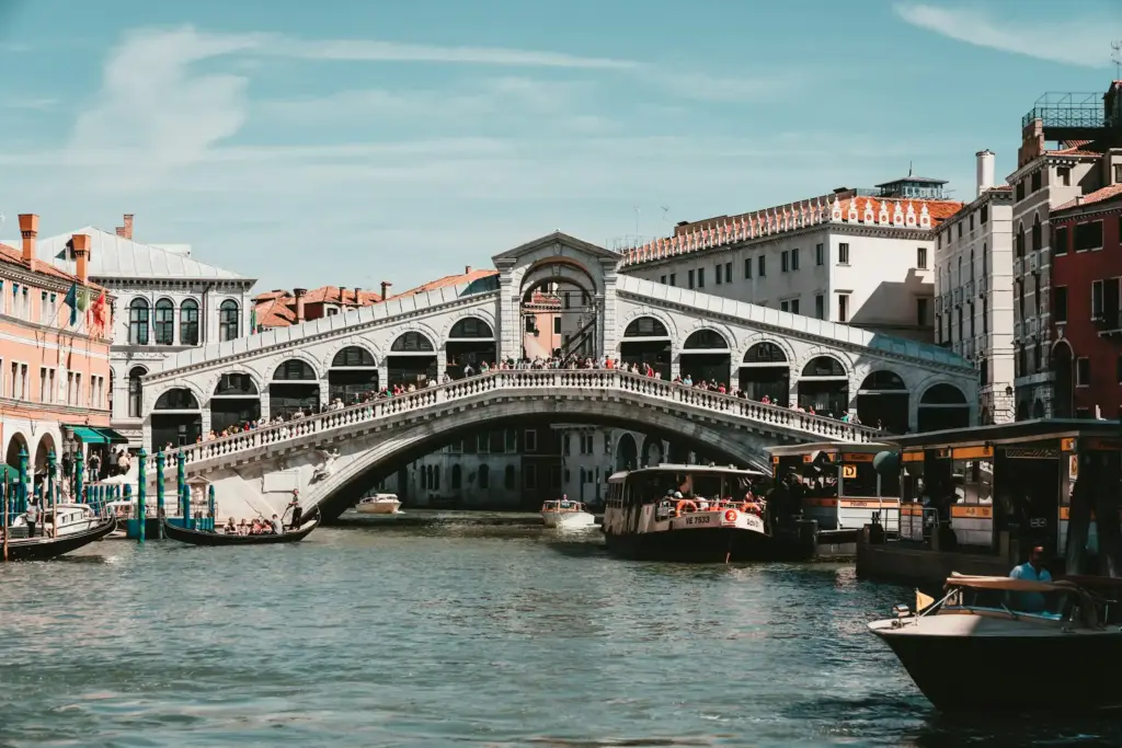 The arched stone Rialto Bridge over the Grand Canal in Venice