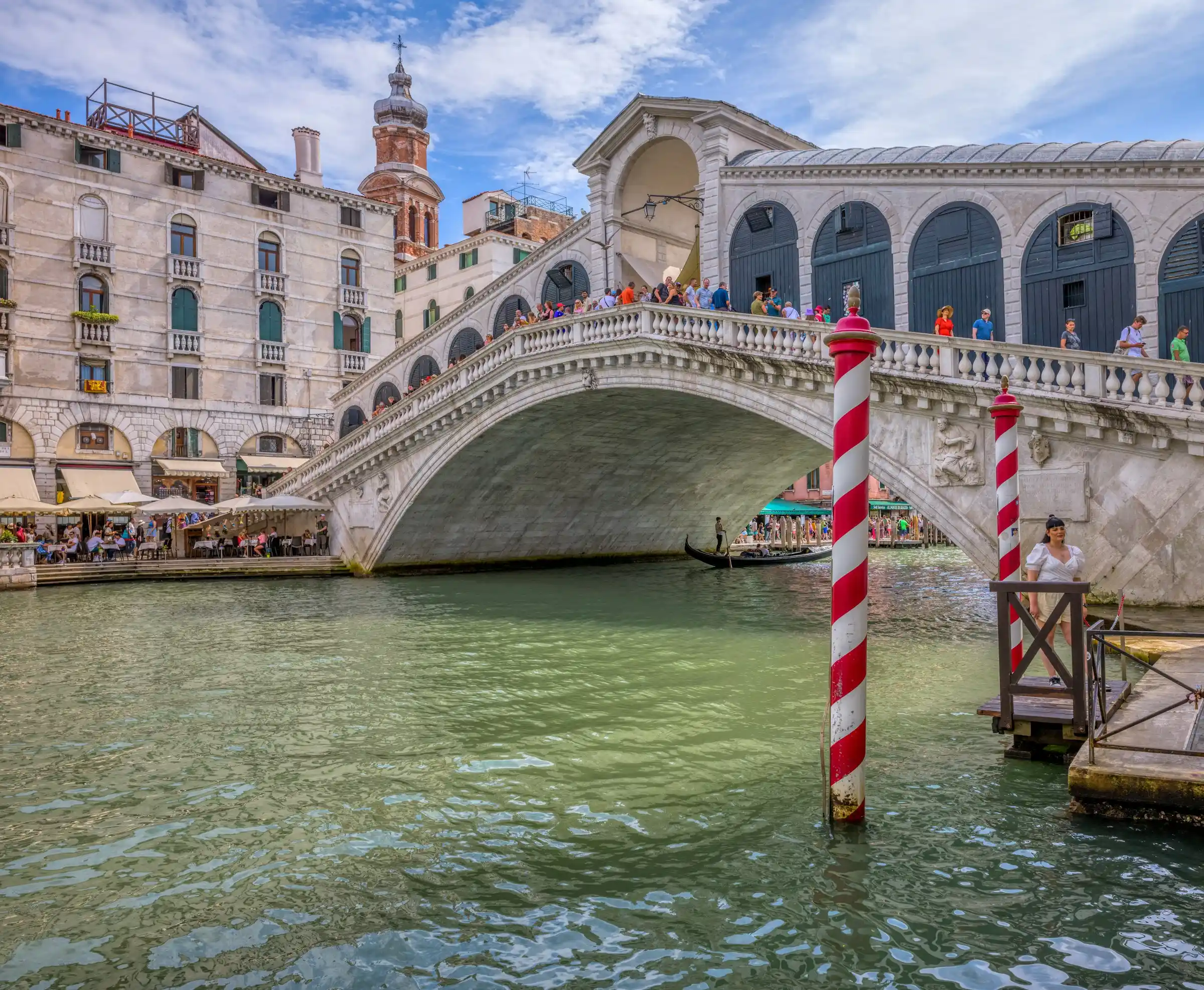 The arched stone Rialto Bridge over the Grand Canal in Venice