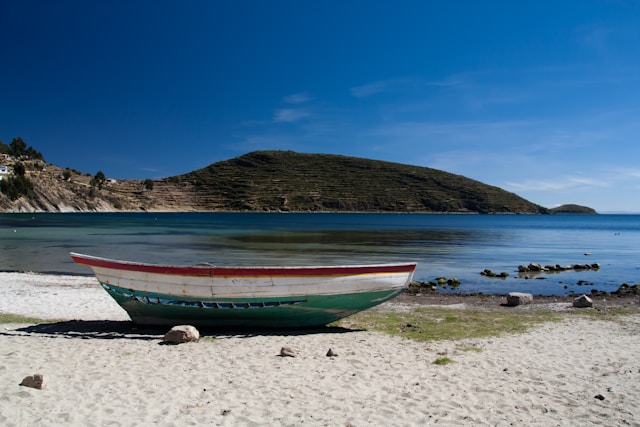Isla del Sol showing terraced green hillsides rising from Lake Titicaca
