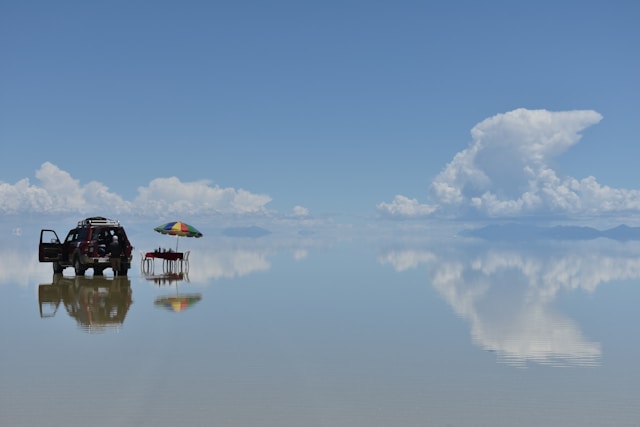 Salar de Uyuni during the wet season showing a perfect mirror reflection of the sky across the flooded salt flat