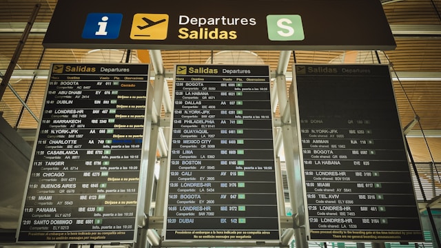 Airport departure board showing flight times