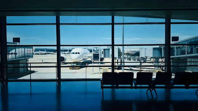 Passengers relaxing at an airport gate before boarding