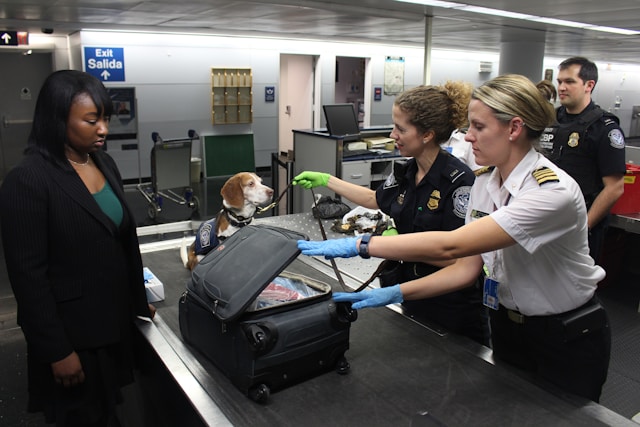 Passengers waiting in an airport security queue